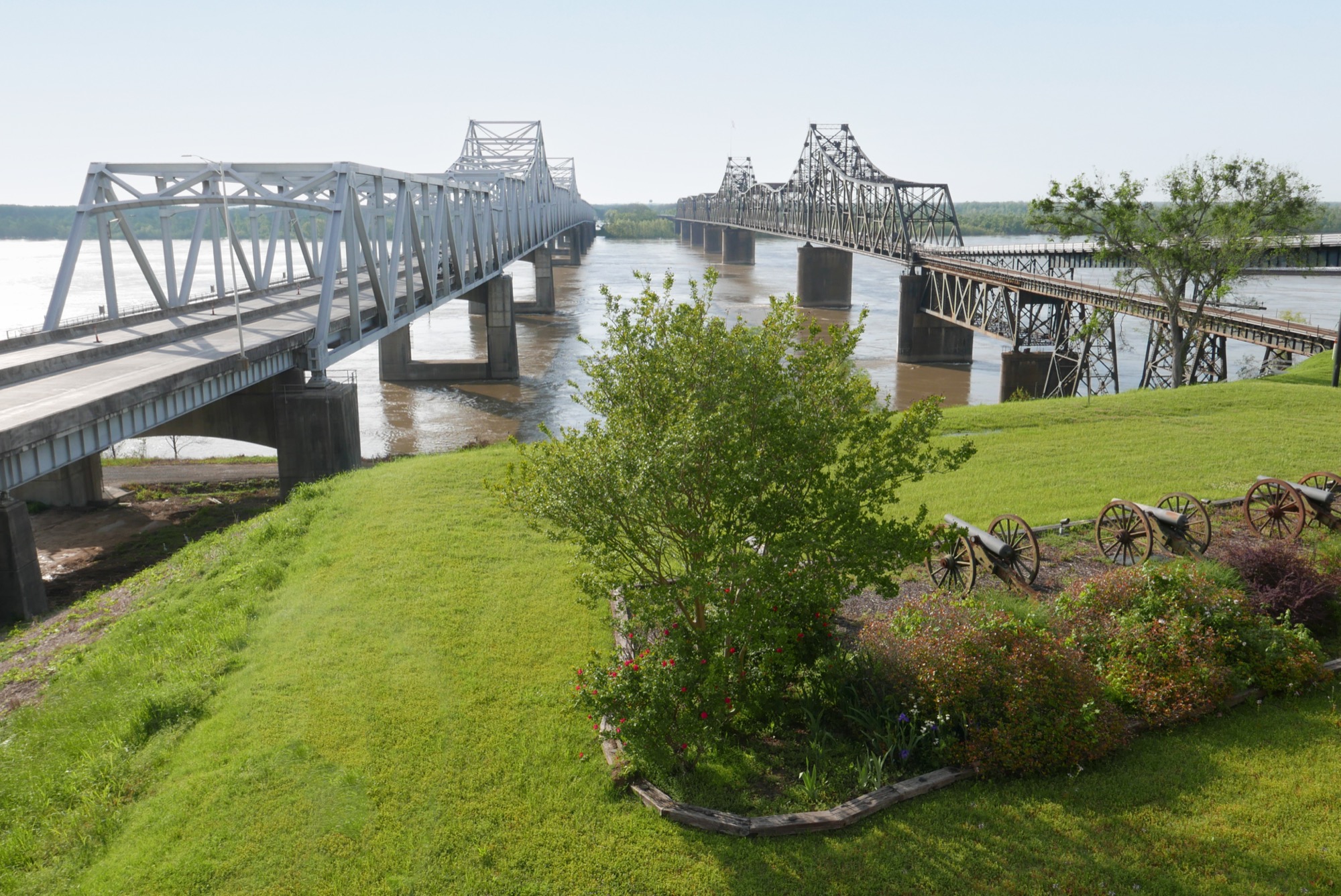 Two long bridges crossing the wide, brown Mississippi River at Vicksburg.